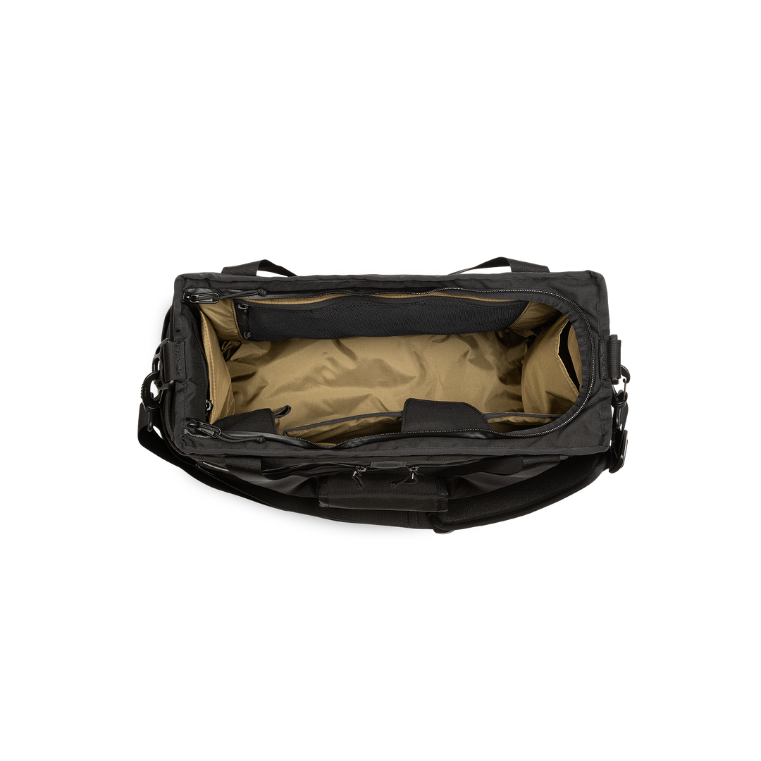 32L Mission Hauler Tote (Covert Black) with main compartment open showing Coyote interior and pockets on a white background / Covert Black