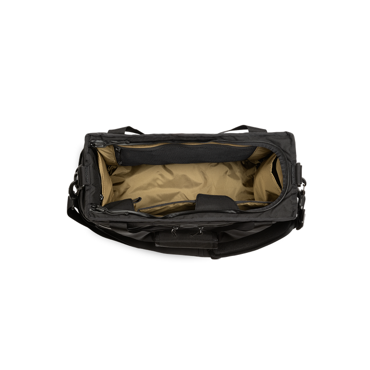 32L Mission Hauler Tote (Covert Black) with main compartment open showing Coyote interior and pockets on a white background / Covert Black