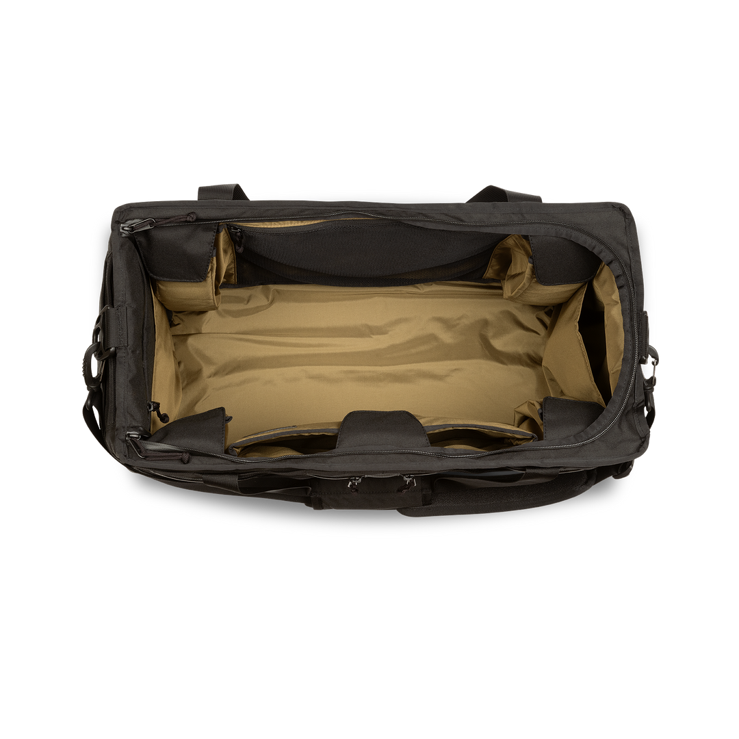 58L Mission Hauler Tote (Covert Black) with main compartment open showing Coyote interior and pockets on a white background / Covert Black