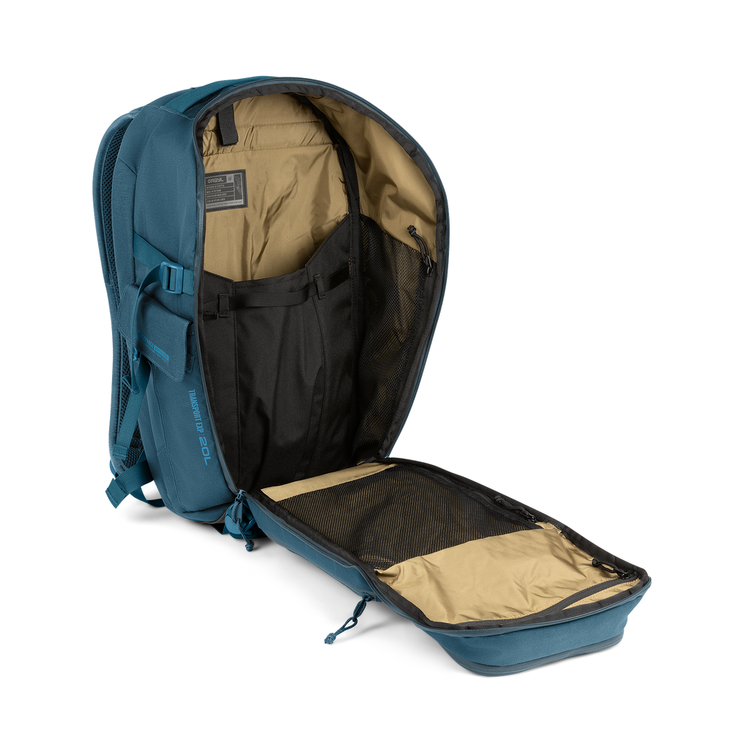 20L Transport Backpack (Wander Blue) with open compartment showing Coyote interior on a white background / Wander Blue