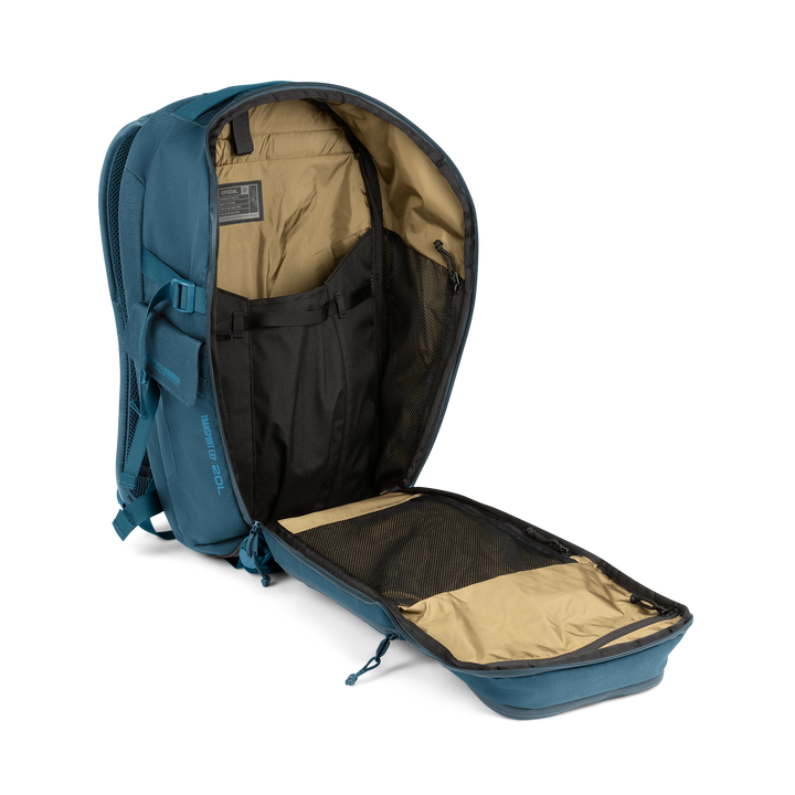 20L Transport Backpack (Wander Blue) with open compartment showing Coyote interior on a white background / Wander Blue