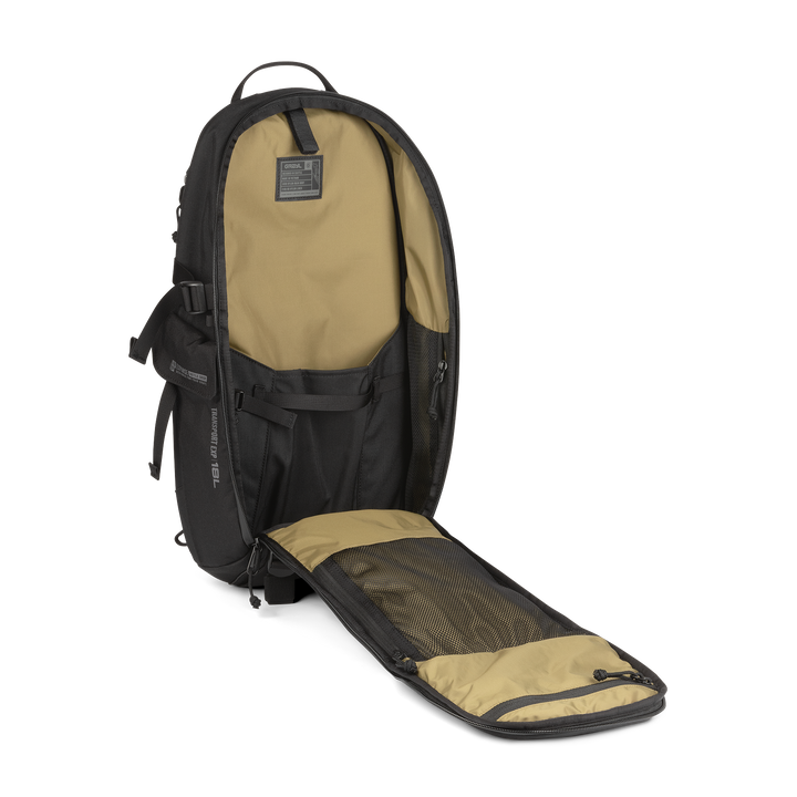 18L Transport Sling Daypack (Covert Black) with open compartment showing Coyote interior on a white background / Covert Black