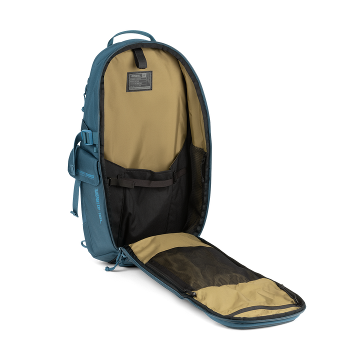 18L Transport Sling Daypack (Wander Blue) with open compartment showing Coyote interior on a white background / Wander Blue