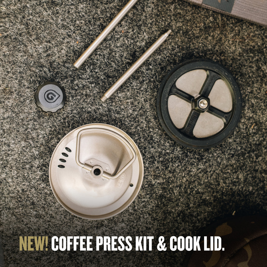 Coffee press kit components on a granite surface. / PLUS COOK LID (V2) / Natural